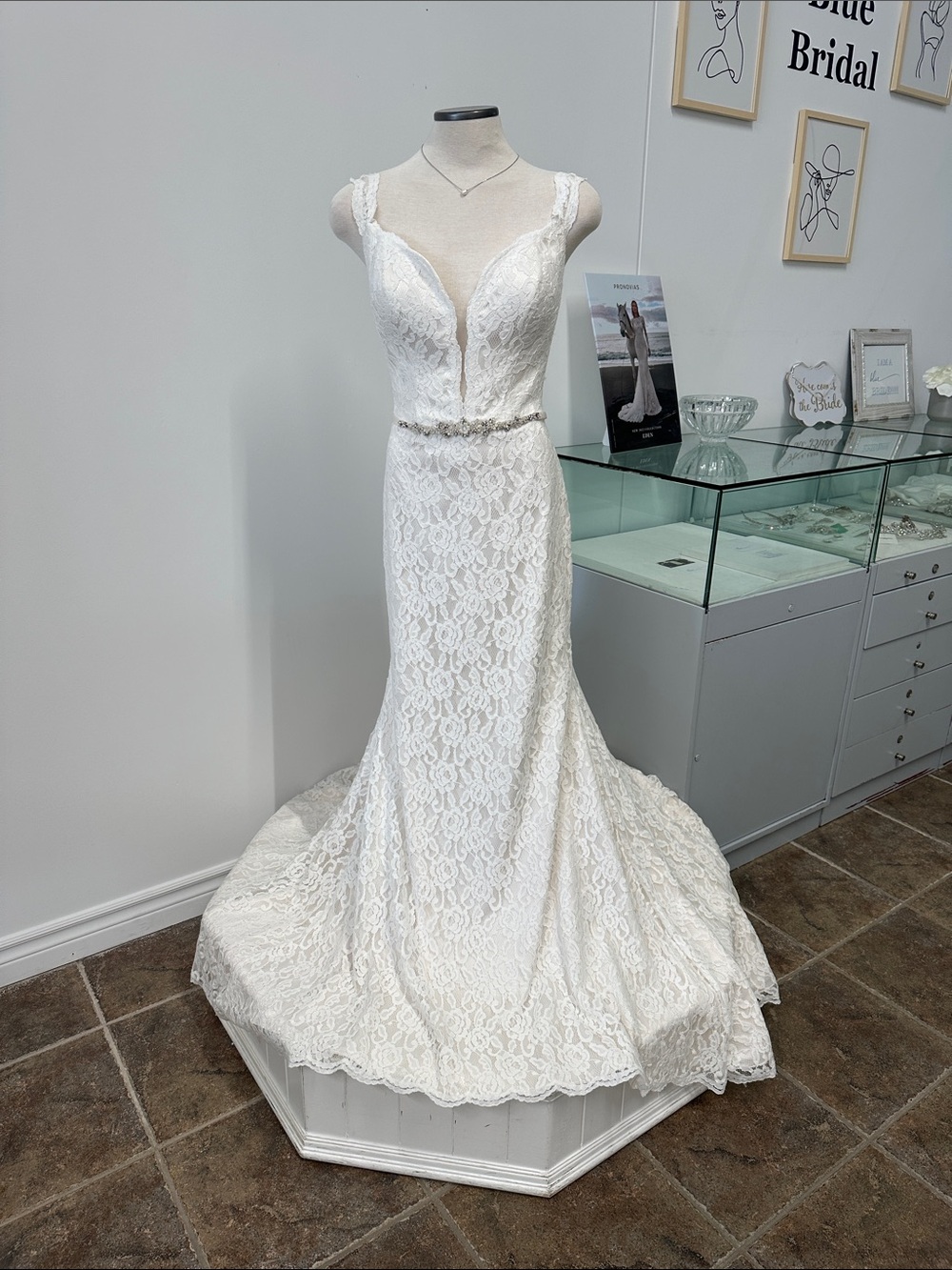 Ivory Lace Bridal Gown with Deep V-Neck and Beaded Waist